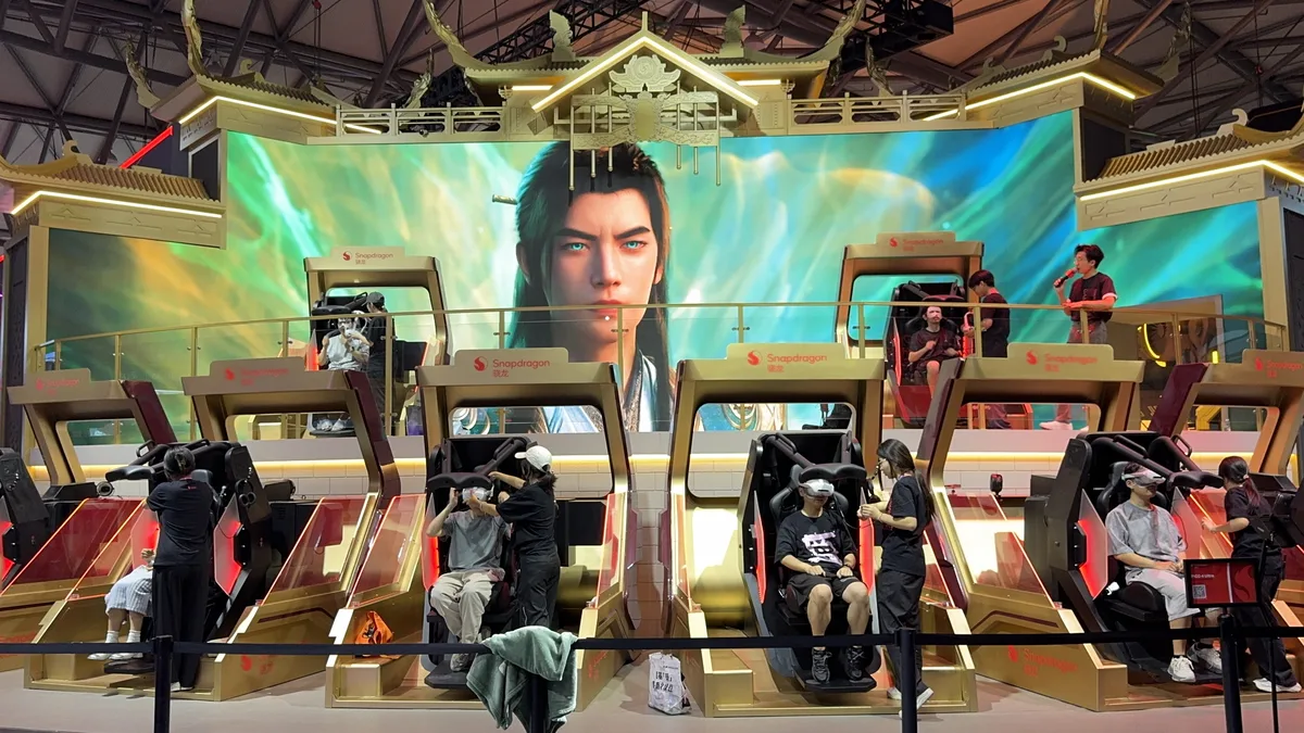 Players trying games at an interactive expo booth in China
